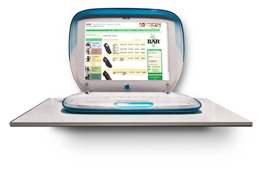 Open blue laptop displaying an online shoe shop on the screen