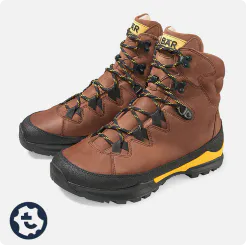 Brown Bergkomfort hiking boots 2.0 with yellow accents and deep tread, ideal for challenging hikes.