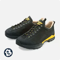 Black hiking boot with yellow accents, ideal for mountain hikes. Shows detailed craftsmanship and durable sole.