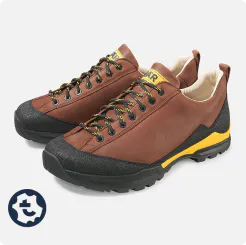 Sturdy brown hiking boot with black rubber sole and yellow details, ideal for outdoor adventures
