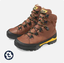 Brown leather hiking boots with yellow accents and sturdy sole, ideal for mountain hikes