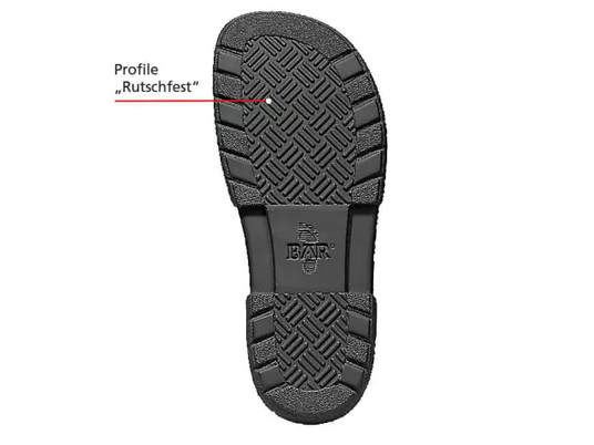 Detailed view of a non-slip shoe sole with marked tread