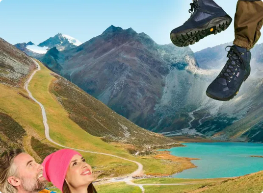 Homme et femme observent des chaussures de randonnée en montagne avec un lac en arrière-plan