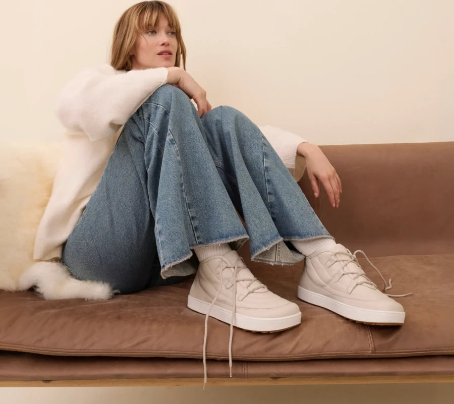 Model wearing BÄR shoes on the sofa
