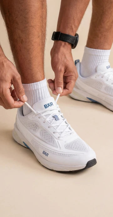 Man with white BÄR sports shoes