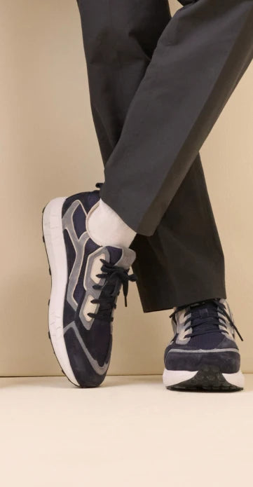 Man with blue BÄR sneakers